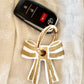 Stripey Bow Resin Keyrings: Green/White/ Silver