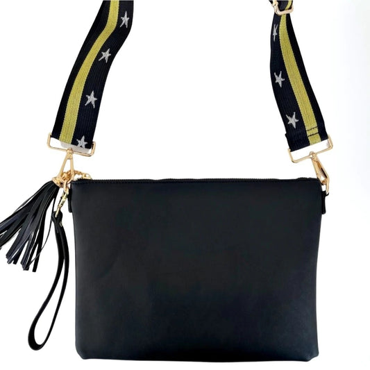 Black bag with leather tassel and bag strap with yellow stripe and star detailing