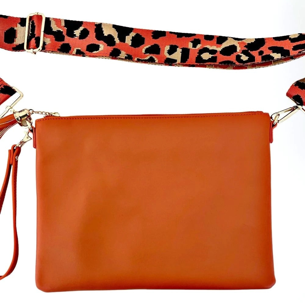 Orange leather bag with leopard bag strap